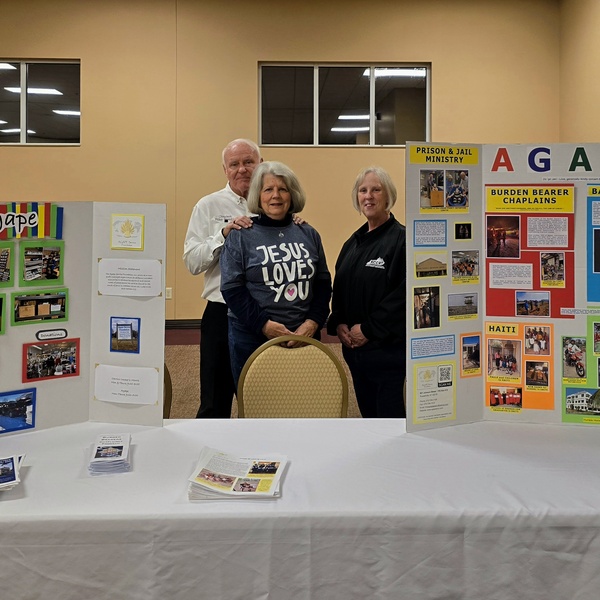 Info table at the Country Ham Breakfast 2025 featuring Mike & Janice Humble and Teresa Richey